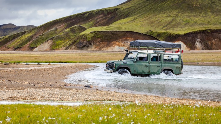 4x4 super jeep crossing river in Thorsmork.