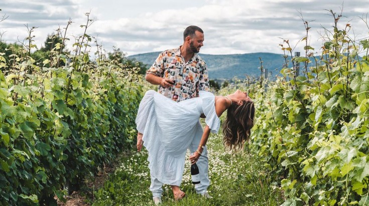 Claudia and Kaan posing amidst the greenery.