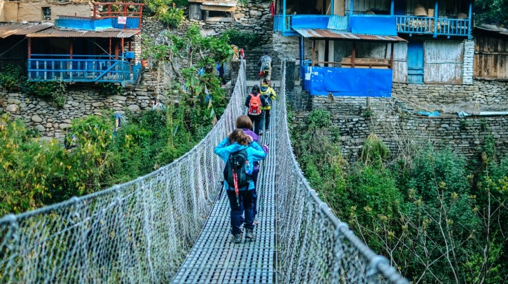 Cross suspension bridges while hiking in Tikhedhunga in 5 days in Nepal.