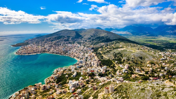 Immerse yourself in the beautiful city of Saranda and explore its highlights Aerial view of Saranda with Lekuresi Castle in South Albania