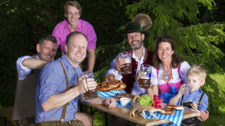 A family wearing the traditional Bavarian outfit