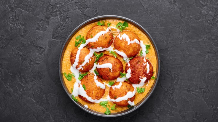 A genorous serving of malai kofta, a famous traditional Indian food.