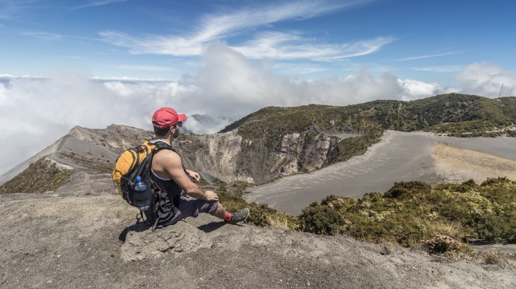 A man resting on his Irazu Volcano National Park hike.