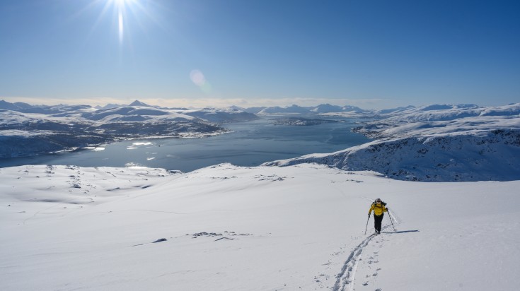 A man skiing the slopes of Tromso.