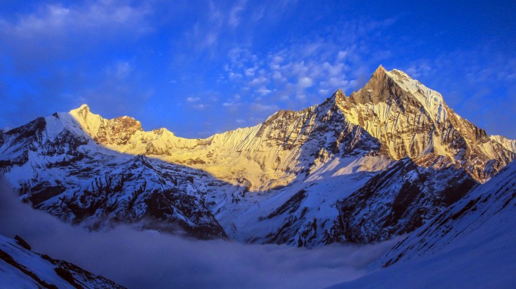 View Mount Annapurna from Annapurna Base Camp while trekking in Nepal.