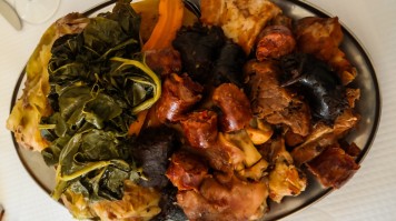 A plate with an assortment of cooked meat and vegetables