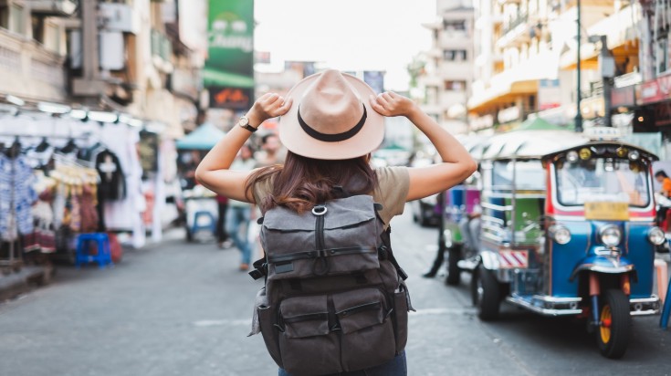 Woman tourist travelling in the Khao San road in Bangkok.