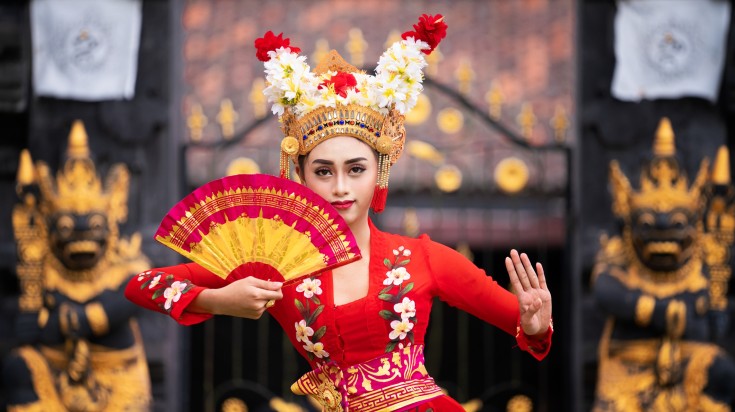 A Balinese girl performing in traditional dress in Bali.