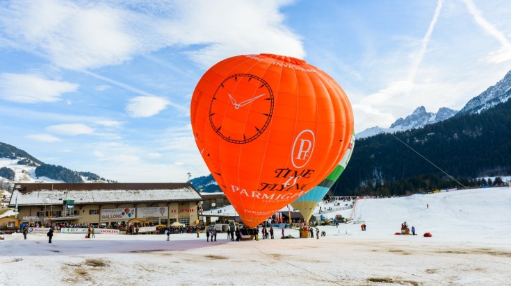 Rides Hot-Air balloons like this in Château-d'Oex in January,