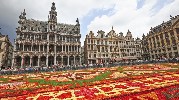 The main square of Grand Place covered in flowers for the Flower Carpet.
