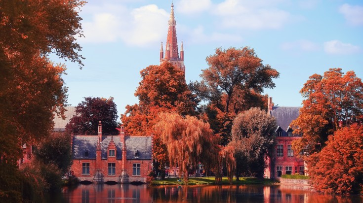 Red tree foliage in Bruges in Belgium in September.