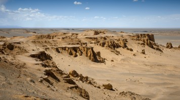 The Flaming Cliffs of the Gobi Desert on a clear day in Mongolia. 