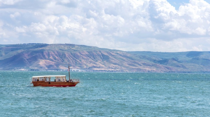 Boat at Sea of Galilee  on a cloudy day.