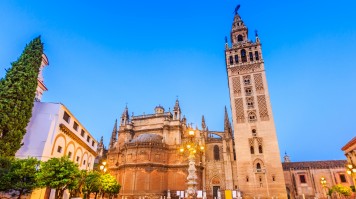 The walls of the Seville Cathedral is decorated with decorative painted ceramic tiles. The Seville Cathedral in Spain has stunning architecture.