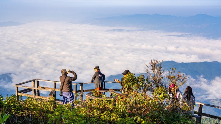 Tourists taking sunrise pictures at the viewpoint area on Doi Inthanon.