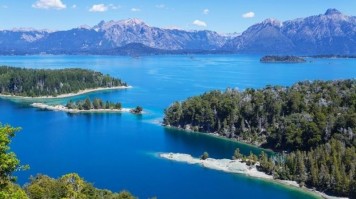 Lago Llanquihue in Chile on a clear day with mountains in the back.