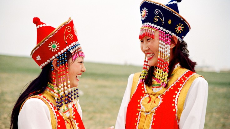 Women in traditional attire during Naadam in China in July.