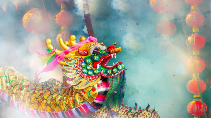 Dragon with firecrackers in Shanghai in March.