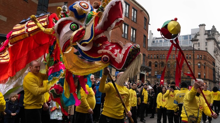 Parade carrying dragon to celebrate New Year Parade in England in February.