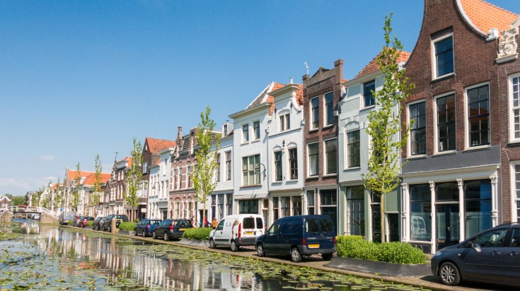 Row of houses along the Turfmarkt canal in the city of Gouda.