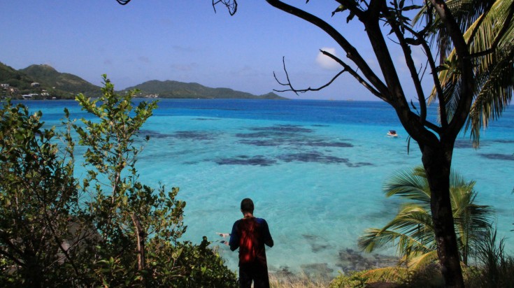 A man looking at the sea at Providencia in Colombia.