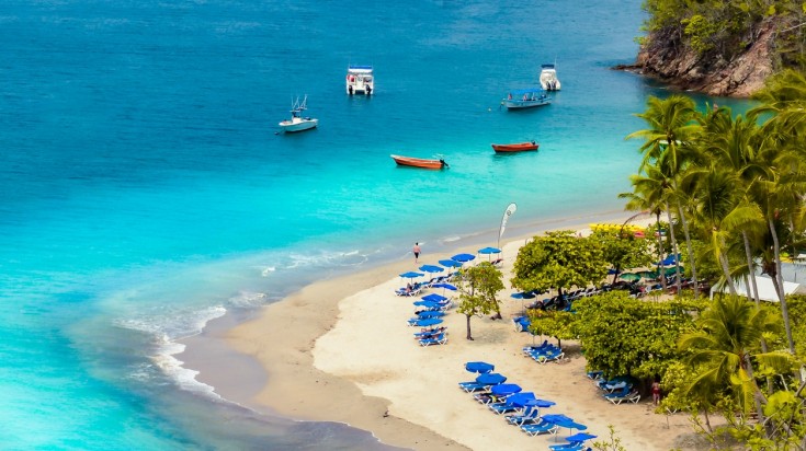 Tortuga island in Costa Rica lined with sail boats for tourists. 