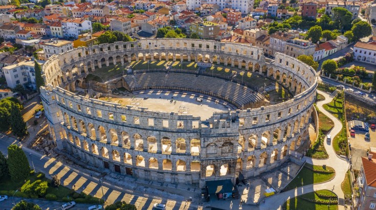 Visit the colosseum in Croatia in December when it is sunny.