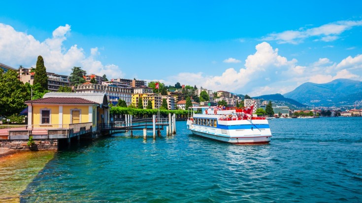 Take a cruise tour in Lugano lake in warm summer weather.