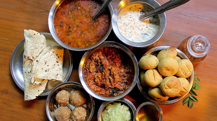 Daal bati churma served along with other Rajasthani food items.