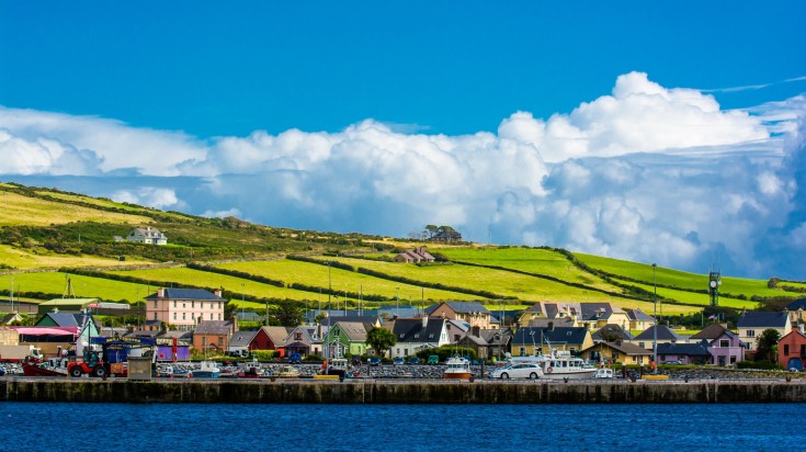 Houses with hills in the distance on the Coast of Dingle in Ireland.