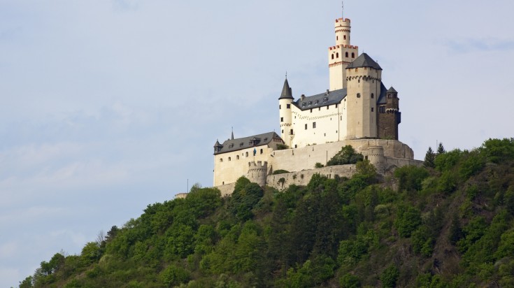 Distant view of Marksburg Castle on a cliff.