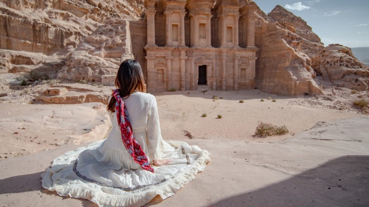 A girl admiring the beauty of Petra in Jordan.