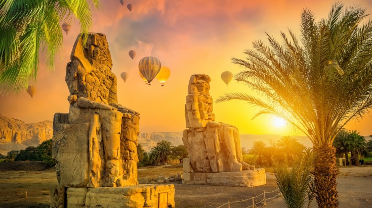 View the Colossi of Memnon from a hot air balloon ride.