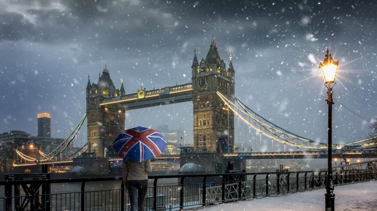 Snowfall in Tower Bridge in the evening time with cold temperature in December.