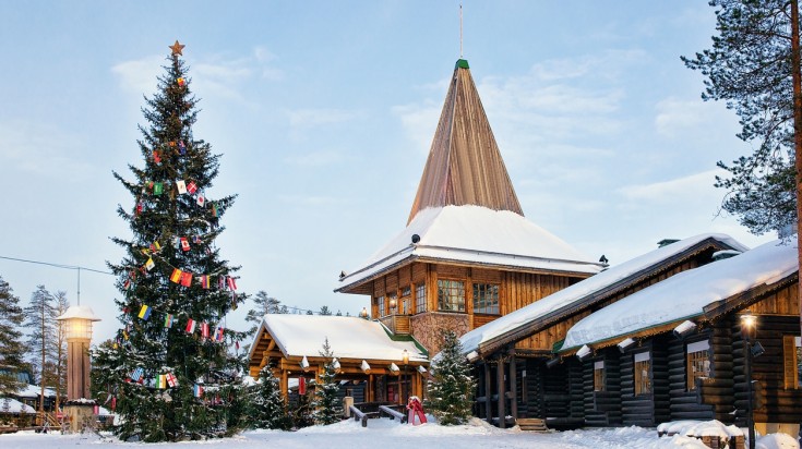 Santa Claus Office in Santa Village with Christmas tree, Lapland, Finland, on Arctic Circle in winter. Santa Claus Village with Christmas tree in Lapland, Finland