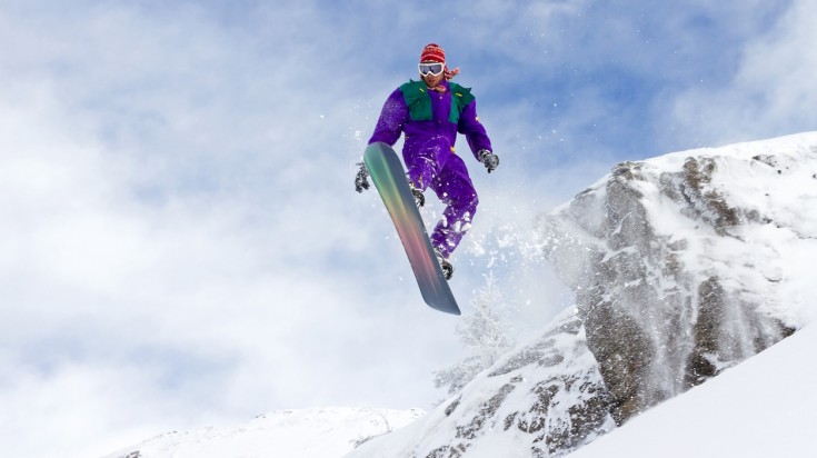 A snowboarder jumps of a cliff in Les Portes du Soleil in France in March.