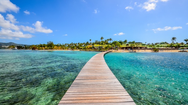 clear water with a pontoon leading to an island in Martinique in France