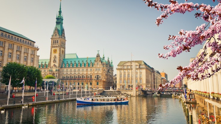 Gorgeous flowers bloom around Hamburg Townhall in Germany in May.