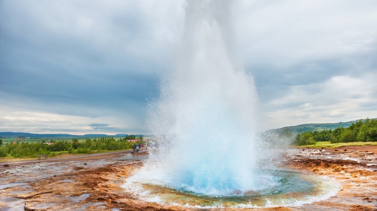 Strokkur Geysir erupting in the golden circle route.