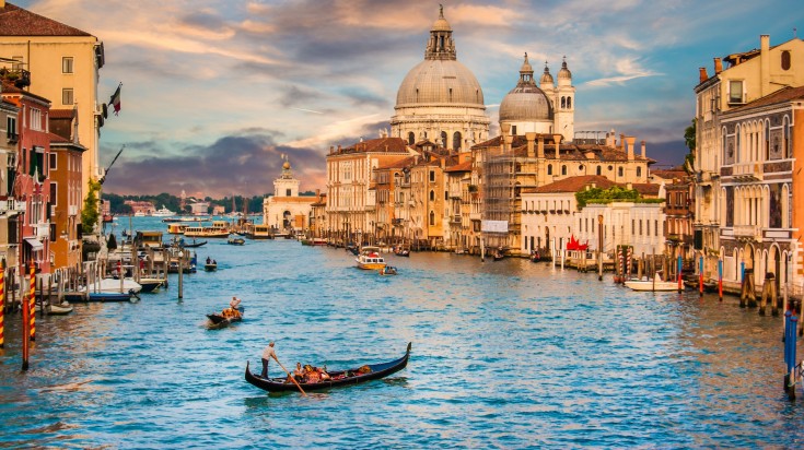 Taking a gondola ride in the Grand Canal of Venice is one of the most popular things to do in Italy.