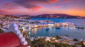 Mykonos port with boats and windmills