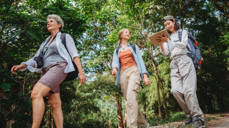 A group of people hiking through the woods in Costa Rica.