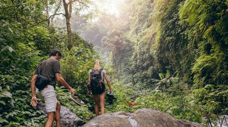 Couple hiking through the jungle in Costa Rica