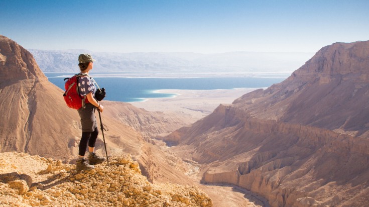 A hiker in the top of the mountain in Israel during summer.