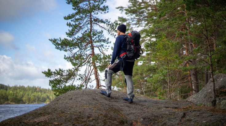 Man on a hiking trip on a Swedish national park.