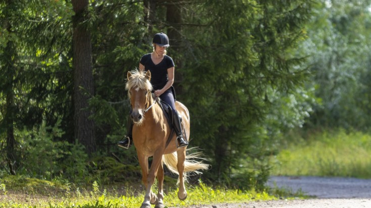 A woman enjoying horseback riding in Bariloche, Argentina.