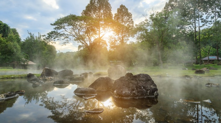 Natural hot spring in the morning in Thailand.