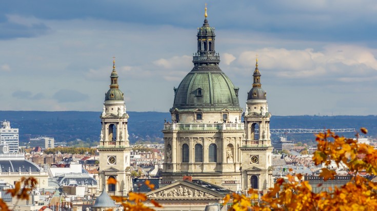 Fall leaves in front of St. Stephen's basilica in Hungary in October.