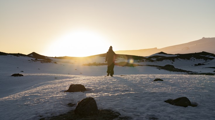 Woman in the snow in Iceland during winter.