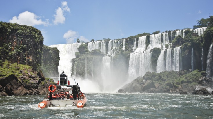 People enjoying boat rides, one of the things to do in Brazil in Iguazu Falls.